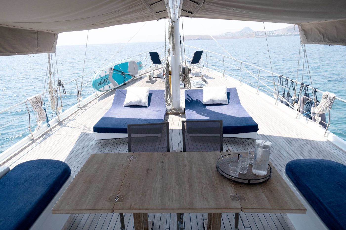 Table and cushioned seating on the front deck
