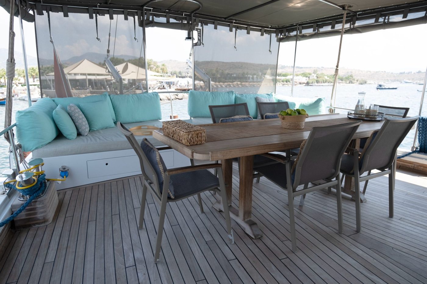 Dining table beside the bar under the awning